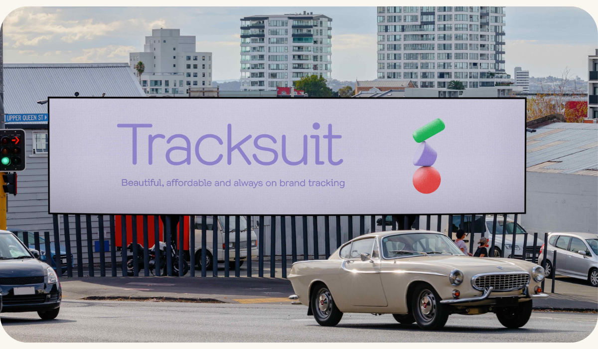 A billboard advertising Tracksuit, a brand health tracking service, emphasizing its qualities of being beautiful, affordable, and always on brand