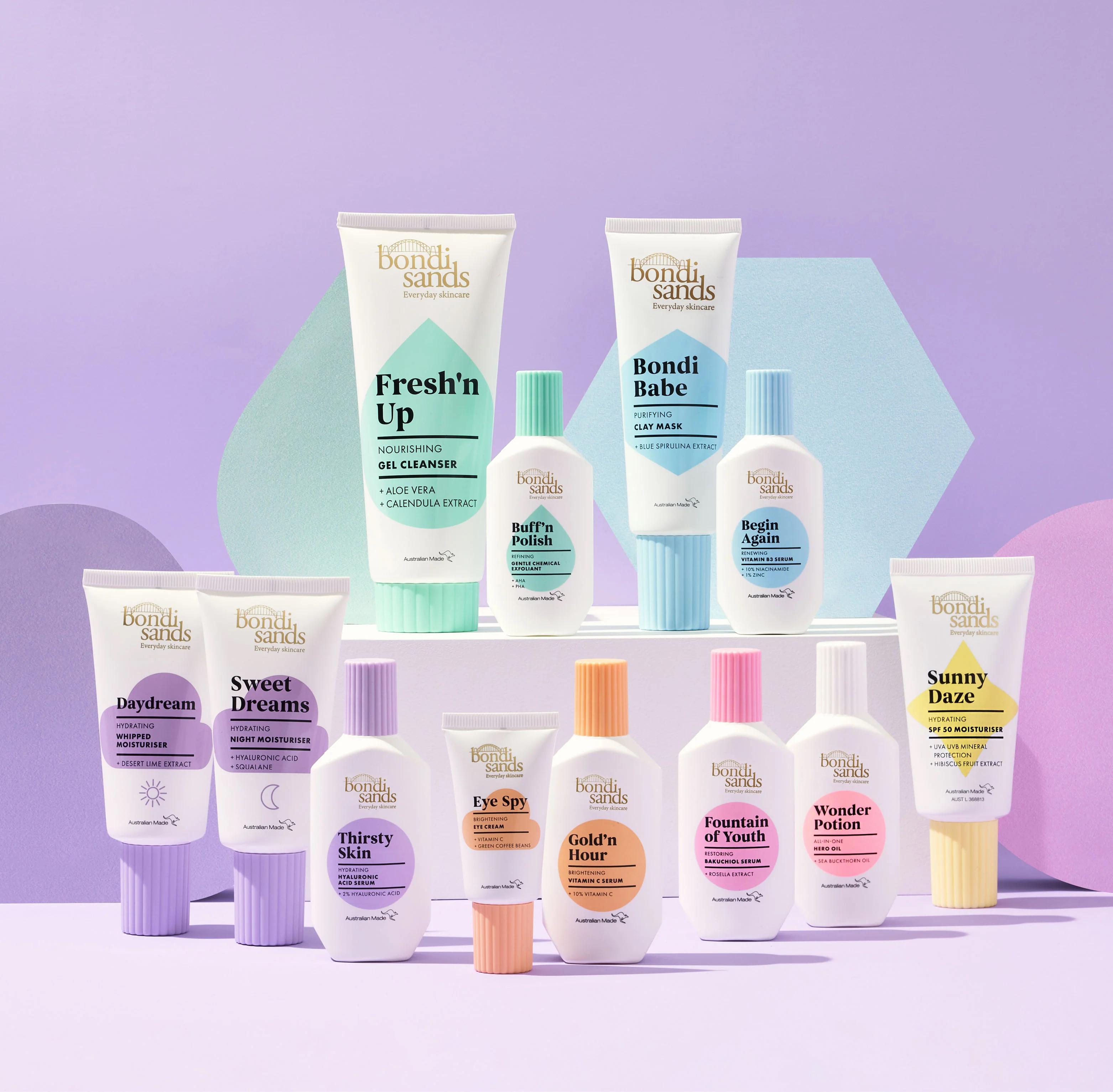 A collection of Bondi Sands skincare and suncare products, including self-tanning lotions, displayed against a vibrant purple background, representing the brand's global presence in the beauty industry.