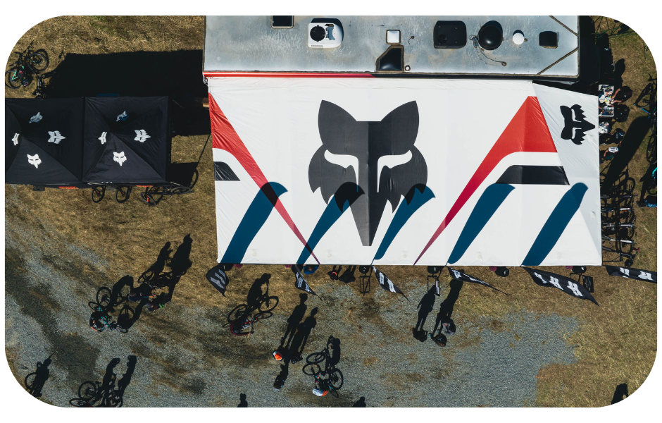 An aerial view of a Fox Racing tent, symbolizing the brand's presence and influence in the ambassador program space