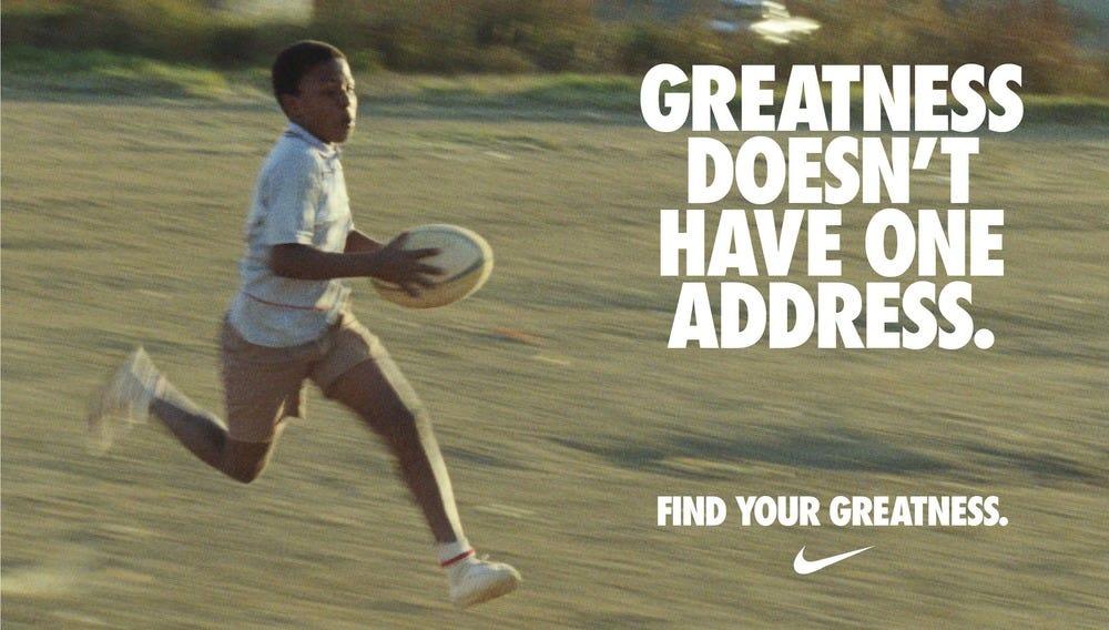 An advertisement for Nike with the text 'greatness doesn't have one address', symbolizing Nike's global reach and commitment to inspiring greatness in athletes everywhere.