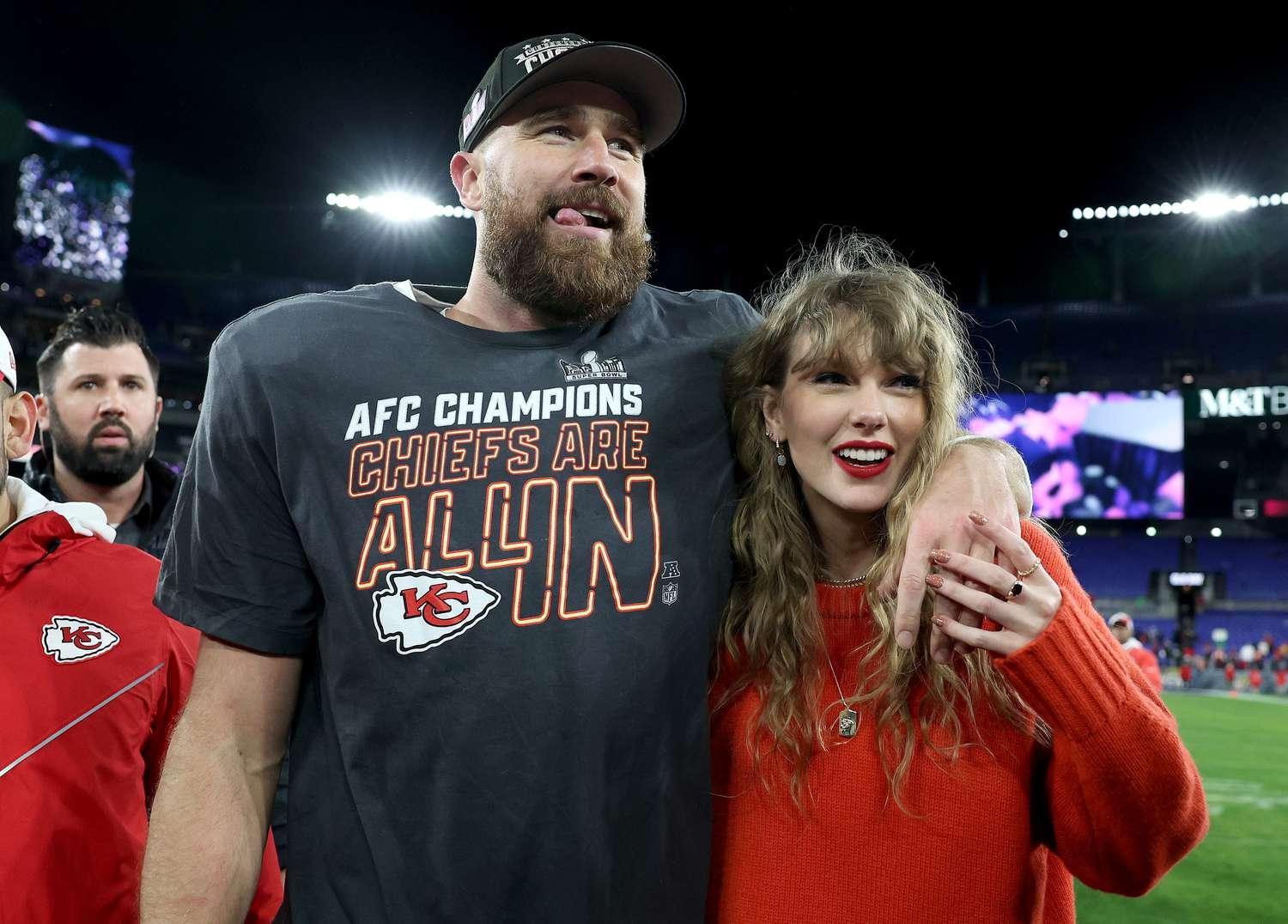 A man and a woman, identified as pop star Taylor Swift and football player Travis Kelce, posing together on a football field, symbolizing their popular relationship in 2024