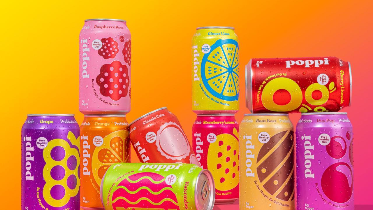 Stacked cans of Liquid Death and poppi soda on a table, symbolizing the comparison between the two brands discussed in the article